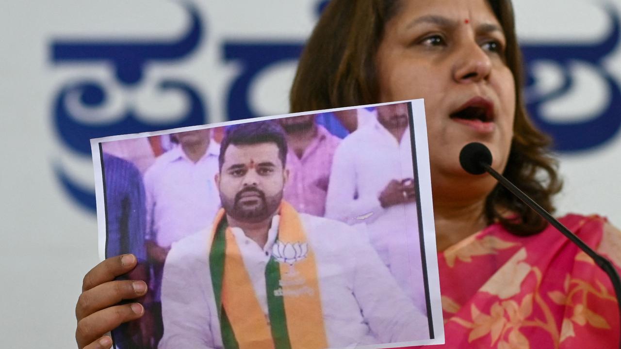 Congress spokesperson Supriya Shrinate shows a photograph featuring Prajwal Revanna, who was summoned for alleged sexual abuse case. Picture: AFP