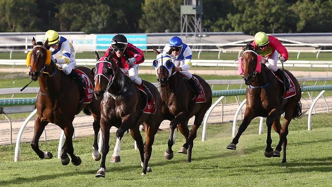 Maquereau, ridden by Lacey Morrison (pink silks, far right) flashed home in the 2021 Cairns Cup, held at the Cairns Jockey Club, Cannon Park. Picture: Brendan Radke