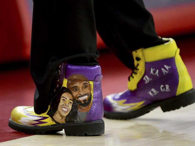 South Carolina coach Dawn Staley wears boots painted to pay tribute to Kobe Bryant and his daughter Gianna. Picture: AP Photo/Michael Woods