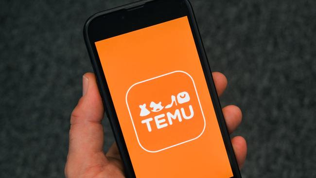 (FILES) This photo illustration shows the logo of fast fashion e-commerce company Temu displayed on a mobile phone in Brussels, on November 4, 2024. The US Postal Service (USPS) has said it is temporarily suspending inbound parcels from China and Hong Kong, evoking an angry accusation of "unreasonable suppression" from Beijing on February 5, 2025. US officials pointed to the growth of Chinese-founded online retailers Shein and Temu as a key factor behind this surge in shipments claiming the exemption in recent years  -- and the halt on February 4 could delay parcels from both companies from entering the country. (Photo by Nicolas TUCAT / AFP)