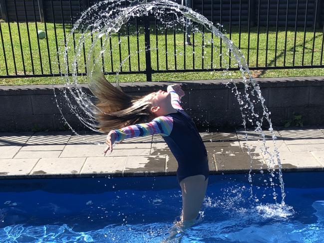 Ruby Clifton, 10, at home in the pool at Beaumont Hills. Picture: Brad Clifton