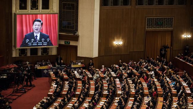 Delegates listen to a speech by China's President Xi Jinping during the closing session of the National People's Congress at The Great Hall Of The People in 2018.