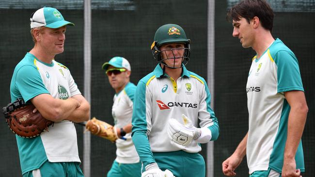 Andrew McDonald with Marnus Labuschagne and Pat Cummins. Picture: AFP Images