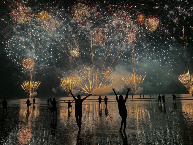 Lily North and Katrina Leembruggen enjoy the fireworks at Mindil Beach Picture: Supplied