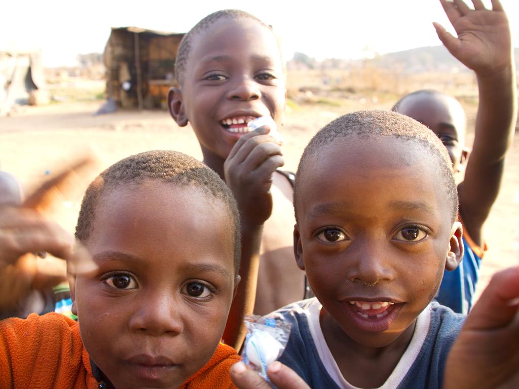 The local kids are welcoming to visitors.