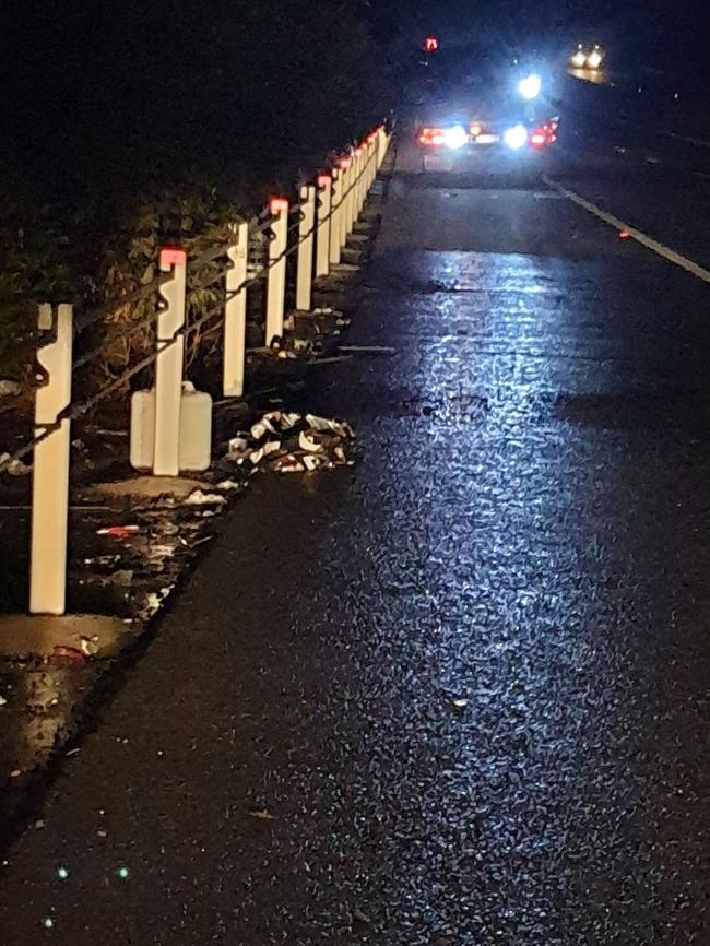 Rubbish left behind in the spot where the car crashed on the side of the highway. Photos: Frances Klein