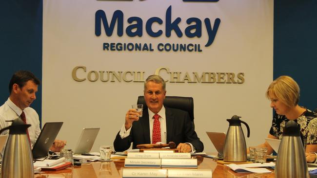 Mayor Greg Williamson raising a glass following Mackay Regional Council's decision to remove fluoride from the region's water in 2016.