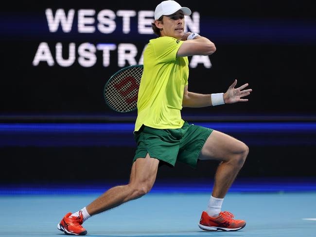 PERTH, AUSTRALIA - JANUARY 03: Alex de Minaur of Team Australia plays a forehand in his singles match against Novak Djokovic of Team Serbia during day six of the 2024 United Cup at RAC Arena on January 03, 2024 in Perth, Australia. (Photo by Paul Kane/Getty Images)