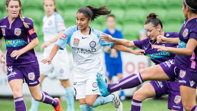 Jacynta Galabadaarachchi holds off Perth's Kim Carroll. Photo: Stuart Walmsley