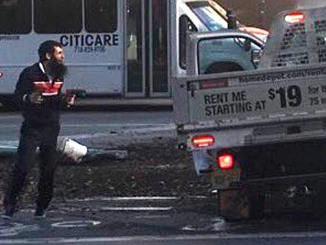 This chilling image shows Sayfullo Saipov pictured at the scene of the terror attack before his arrest.