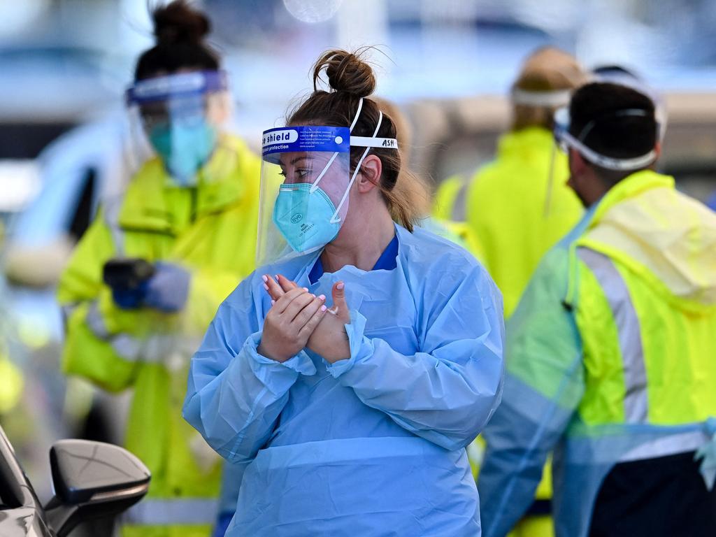 Health workers at the St Vincent’s Hospital drive-through testing clinic at Bondi Beach. Picture: Steven Saphore/AFP