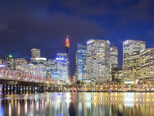 Sydney skyline and Pyrmont bridge at dusk near Darling Harbour, in Sydney Australia