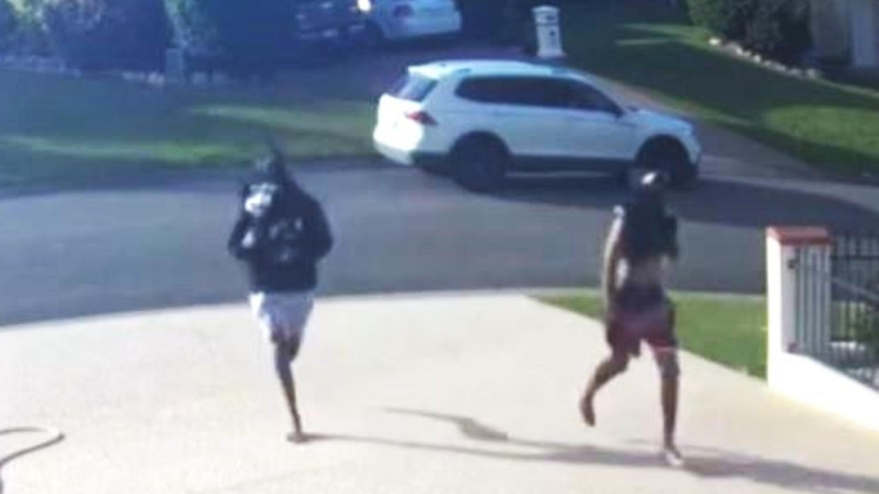 CCTV shows the masked teens creeping into the Minaret Way yard in Mount Louisa before the homeowner watering his plants catches them in the act and on May 5.
