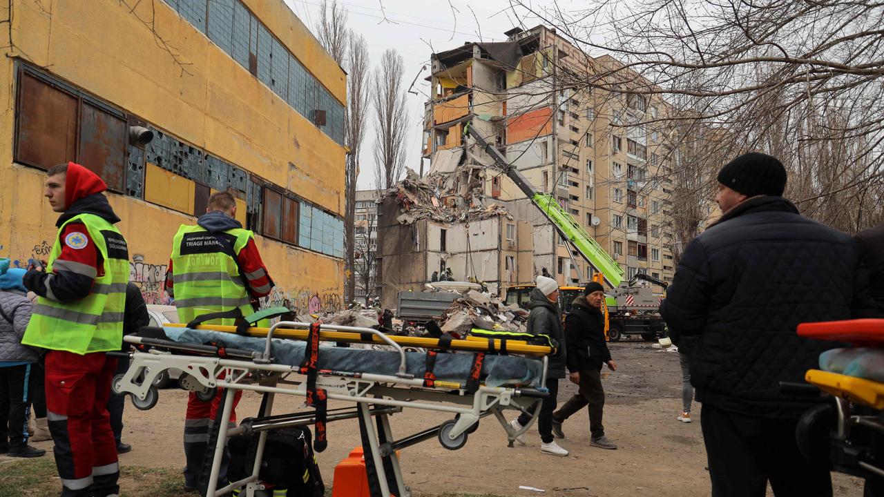 Medics nearby the wreckage in Odesa, during the aftermath of Russia’s latest drone strike. Picture: AFP