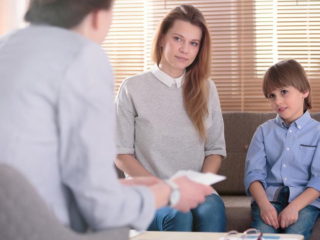 Kid with ADHD and mother listening to counselor during meeting in the office Picture: iStock