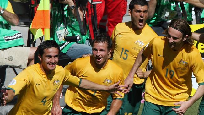 Tim Cahill (left) celebrates his second goald against Japan in the World Cup with Lucas Neil, John Aloisi and Josh Kennedy. Picture: AFP