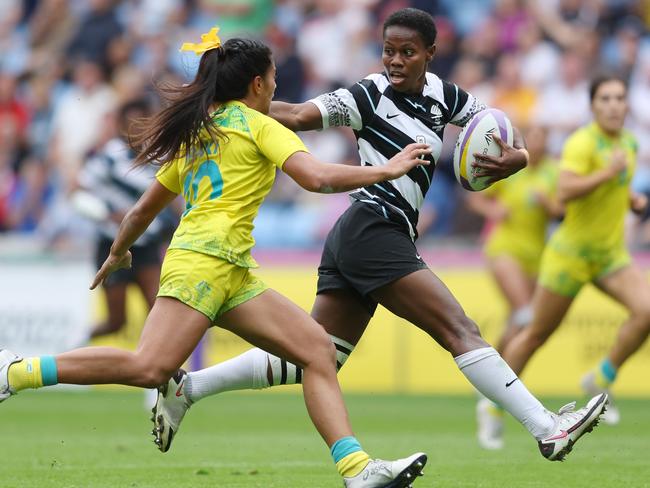 Raijieli Daveua holds off Sariah Paki in Fiji’s win over Australia. Picture: Richard Heathcote/2022 Getty Images