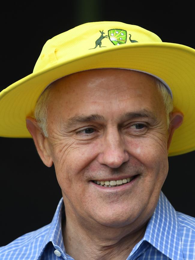 Their attempts to seem relatable to average Aussies serve only to highlight their differences. Malcolm Turnbull in a cricket hat this week.