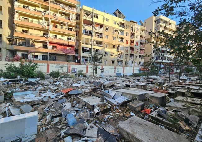 Debris fills a cemetery in south Beirut after a strike