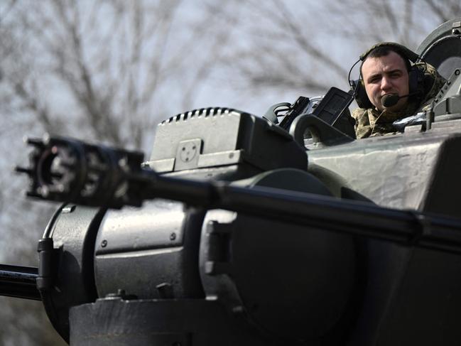 A Ukrainian serviceman, crew member of a German-made self-propelled anti-aircraft (SPAAG), better known as the Flakpanzer Gepard, prepares for a combat duty in Kyiv region, on March 21, 2024, amid the Russian invasion of Ukraine. (Photo by Genya SAVILOV / AFP)