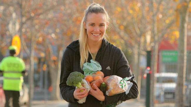 Jordy Elkington with her shopping outside Coles in Camberwell, Melbourne. Picture: STUART McEVOY