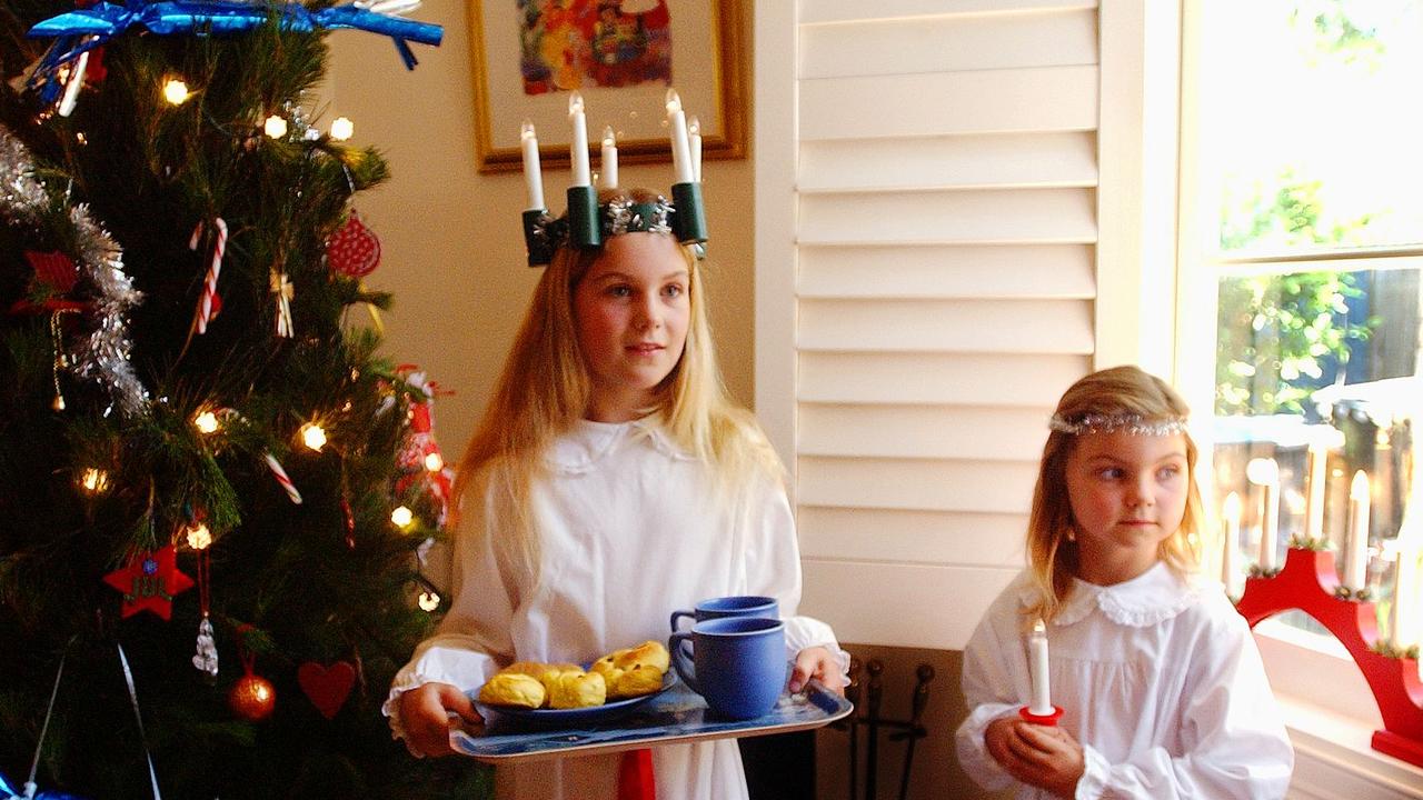 Girls wear white and a crown of candles for St Lucia’s Day. Picture: Carmela Roche