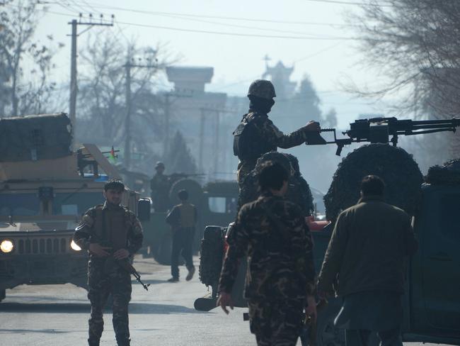 Afghanistan remains a country on the edge, with an estimated 16,000 soldiers or police killed or wounded during 2015. In this picture, security personnel keep watch at the site of a suicide bombing at the home of a prominent politician in Jalalabad on January 17. At least 13 people were killed. Picture: AFP/Noorullah Shirzada