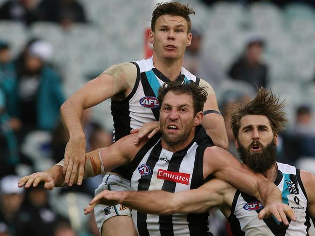 Travis Cloke double-teamed at the MCG. Picture: Wayne Ludbey