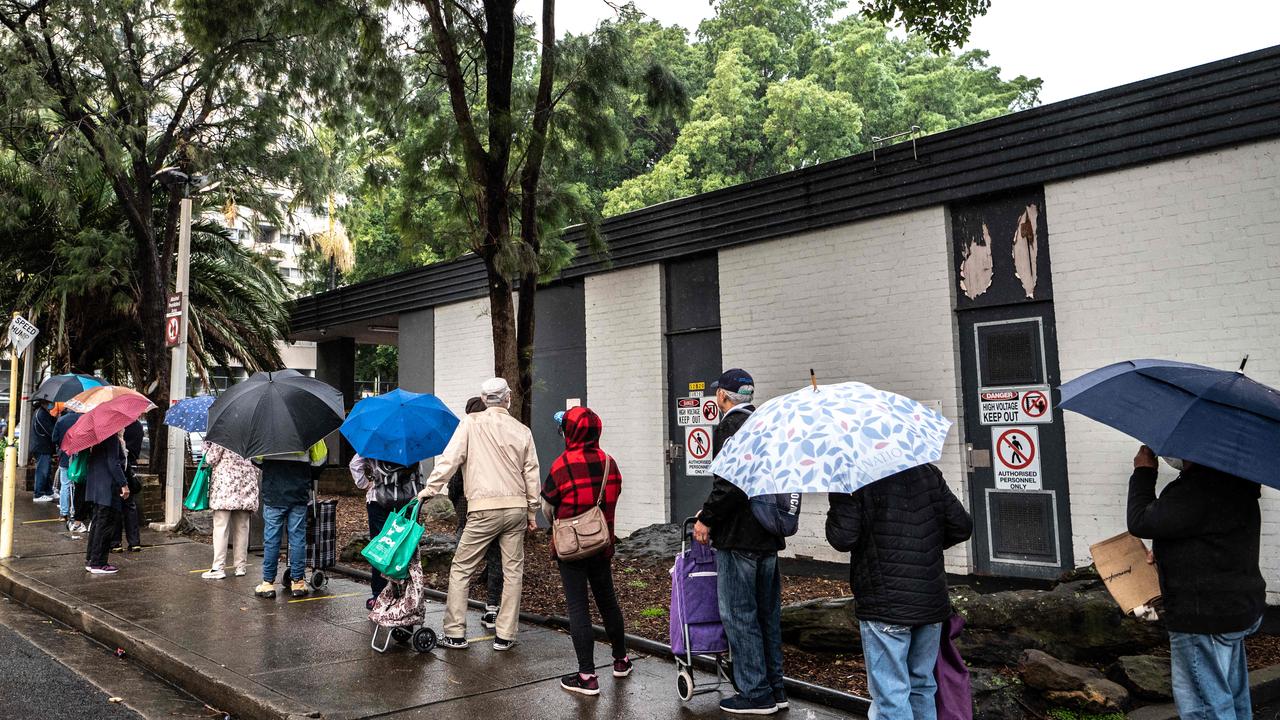 Australians are struggling as inflation bites. Members of the public seen queuing at the OzHarvest Market charity food bank in Waterloo, Sydney. Picture: NCA NewsWire/Flavio Brancaleone