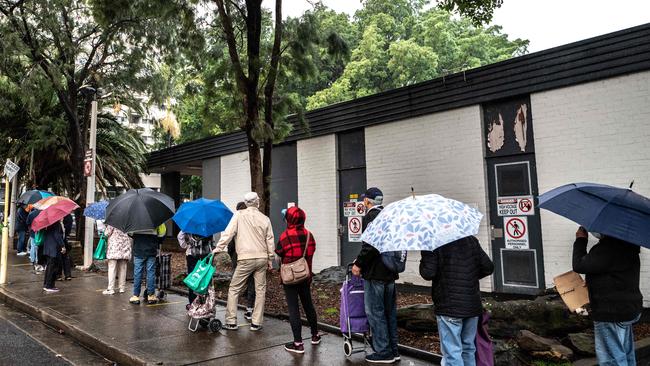 Australians are struggling as inflation bites. Members of the public seen queuing at the OzHarvest Market charity food bank in Waterloo, Sydney. Picture: NCA NewsWire/Flavio Brancaleone