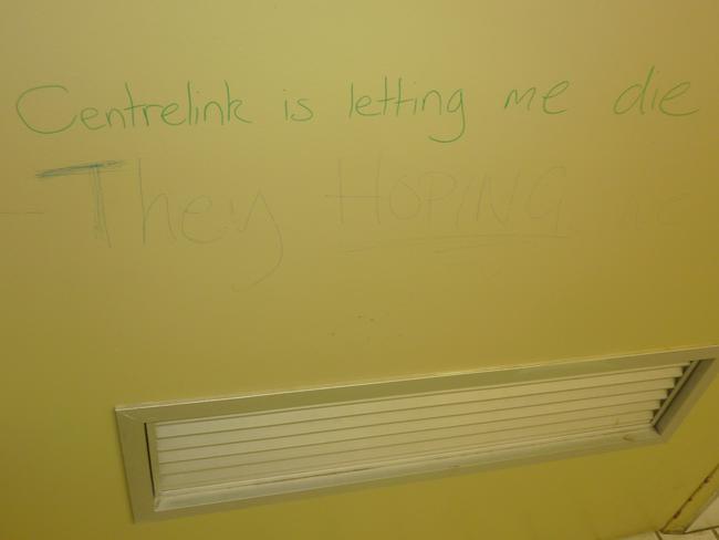 Graffiti on the inside of the door to the disabled toilets at a Sydney branch reads: ‘Centrelink is letting me die.’