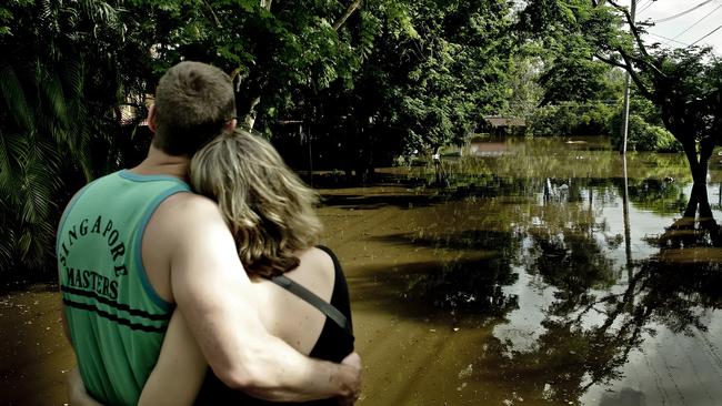 Terry and Larissa Deeth outside their home in Harefield Street, Indooroopilly.