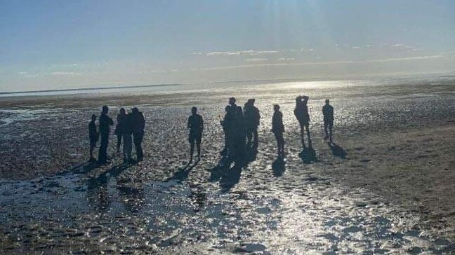 Max’s family and friends gathering at the beach at Deception Bay.