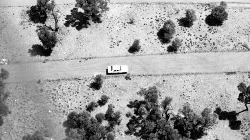 Photographs retrieved from a crashed helicopter as police raced to solve a triple murder in Queensland's Outback.