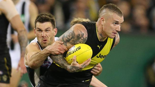 Levi Greenwood tackles Dustin Martin, who was well below his best. Picture: Michael Klein