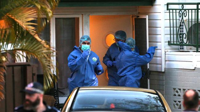 Forensic experts search the Labrador home where a 43-year-old man is believed to have been shot dead. Picture: Regi Varghese.