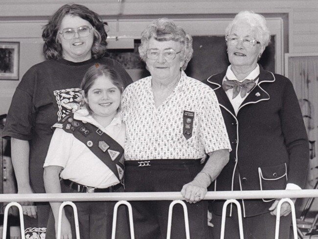 Celebrating Iris King receiving her OAM (L to R) Wendy Drysdale (nee Hooper), Elizabeth Drysdale, Brown Owl Iris King, Heather Beedell (Kankandi-Wellers Hill’s first District Commissioner) in 1993. Picture: Wendy Drysdale.