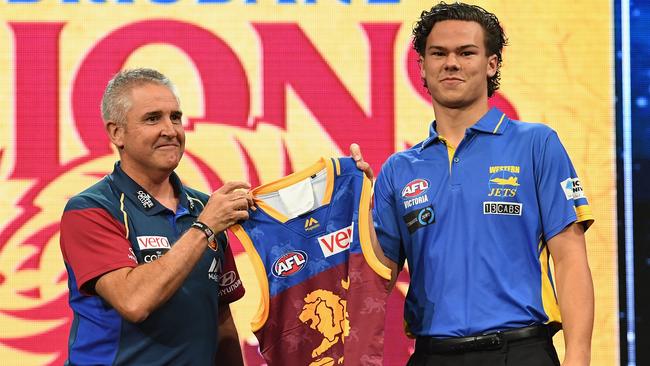 Lions head coach Chris Fagan poses with Cameron Rayner during the 2017 AFL Draft.