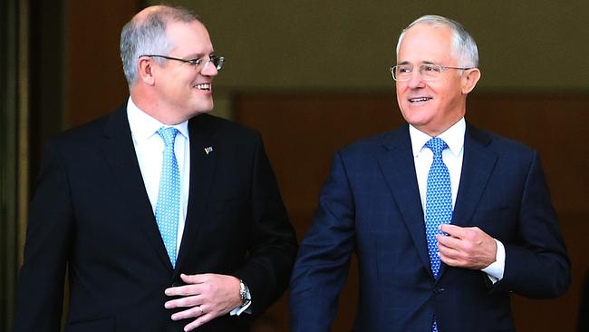 Treasurer Scott Morrison and PM Malcolm Turnbull walking out the front of Parliament House in Canberra to appear on morning TV. Picture Kym Smith