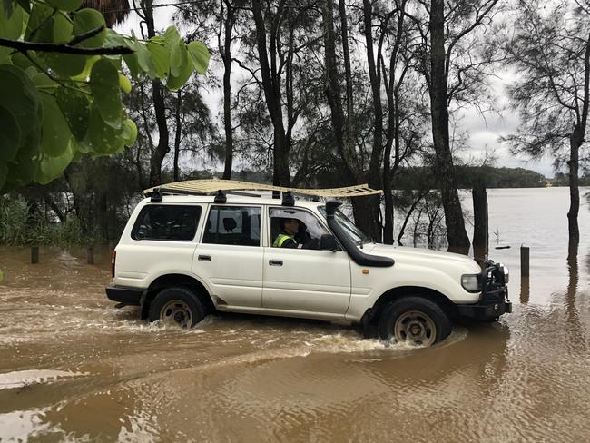 Residents moved cars, boats and belongings to higher ground when the evacuation order was announced. Picture: Jim O'Rourke