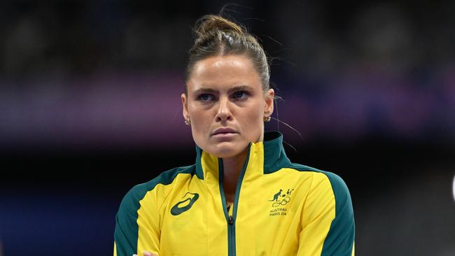 Australian pole vaulter Nina Kennedy looks on as technicians replace a non-functional crossbar raiser which got stuck during the Women's Pole Vault Final at the Stade de France in Saint-Denis, as part of the 2024 Paris Summer Olympic Games in, France, Wednesday, August 7, 2024. (AAP Image/Dean Lewins) NO ARCHIVING