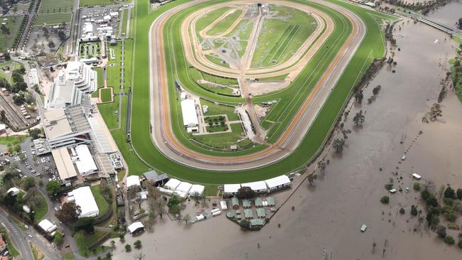 A proposed inquiry would scrutinise the approval of a controversial flood wall around Flemington Racecourse and whether that exacerbated the Maribyrnong River floods. Picture: David Caird