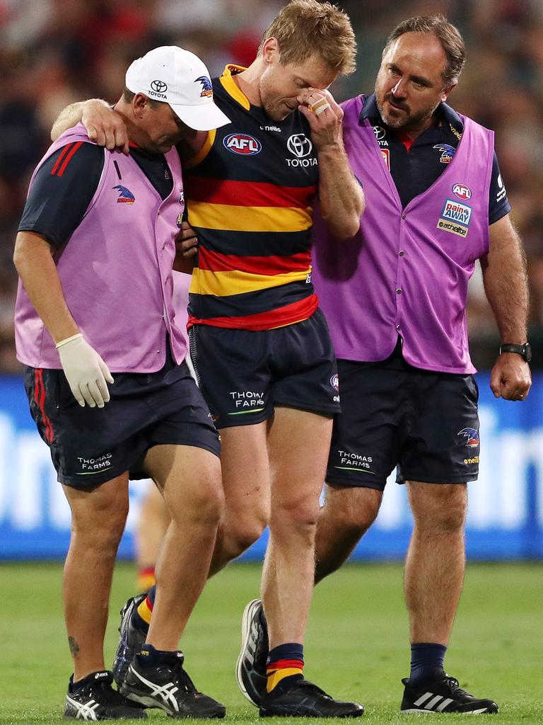 Adelaide skipper Rory Sloane realises he has suffered a serious knee injury.