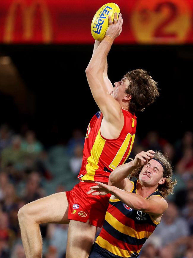 Charlie Ballard marks over Adelaide’s Sam Berry during the Gold Coast’s clash with the Crows at Adelaide Oval on Friday April 2. Picture: James Elsby