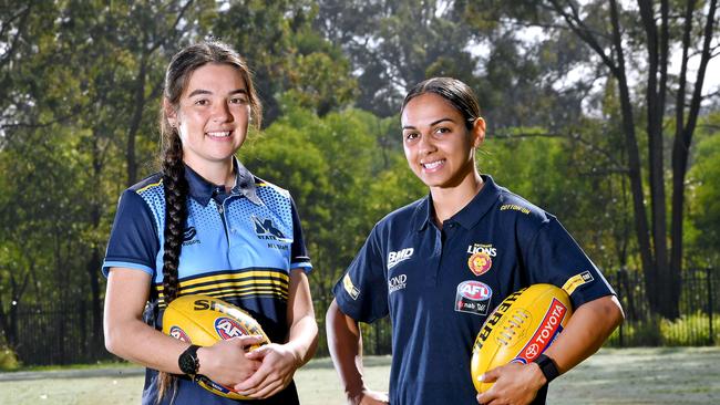 Chloe Marquis with AFLW player Courtney Hodder at Mabel Park State High School. . Picture, John Gass