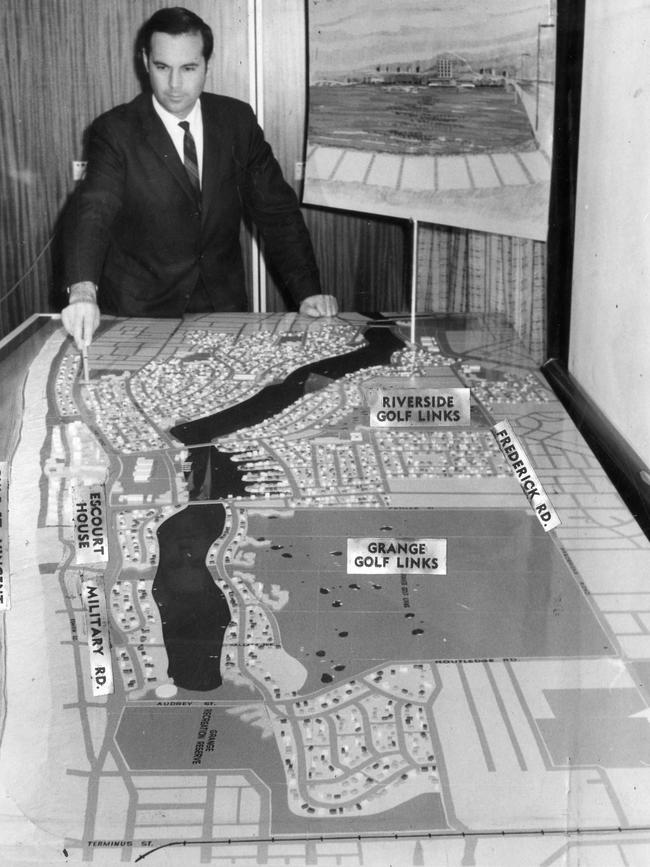 SA politician Premier Steele Hall looking at model of proposed West Lakes housing and lake project near Grange in 1969.