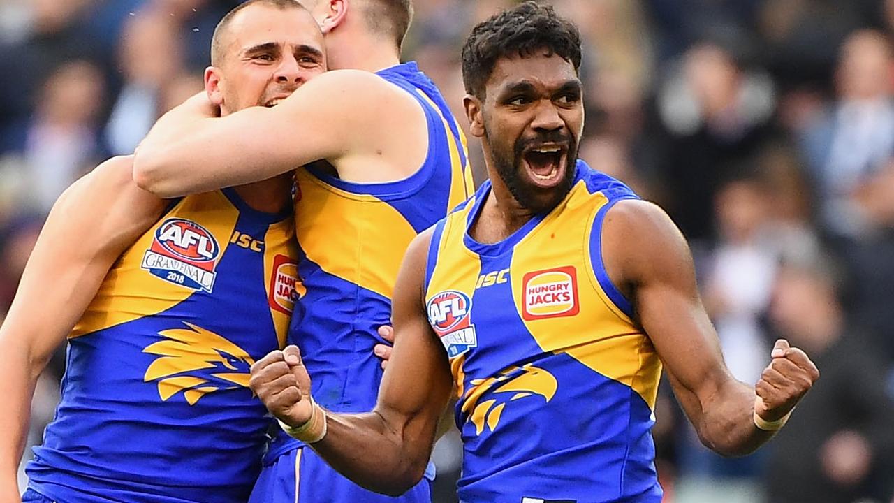 Dom Sheed, Daniel Venables and Liam Ryan celebrate winning the Grand Final.