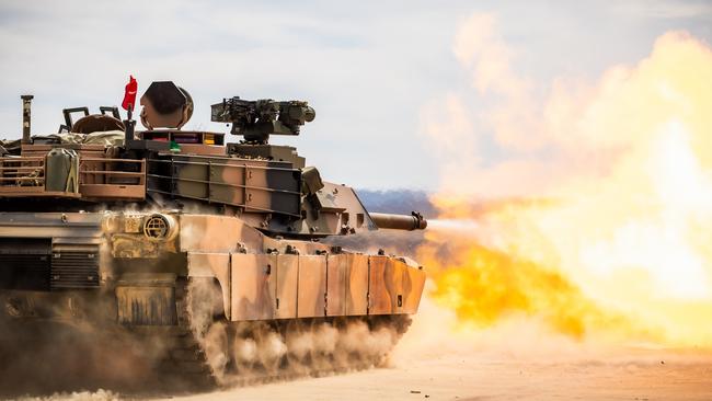 An Australian Army Abrams M1A2 SEPv3 Main Battle Tank during a live-fire serial as part of a qualification course for Royal Australian Armoured Corps soldiers at Puckapunyal Military Area, Victoria. *** Local Caption *** Armys combined arms fighting system will be modernised through the delivery of LAND 907. LAND 907 will deliver M1A2 Abrams System Enhancement Package version 3 (SEPv3) main battle tanks (MBTs). LAND 907 will also deliver the assault breacher vehicle (ABV) and joint assault bridge (JAB) collectively known as the combat engineering vehicles (CEV).The MBT and CEV are manufactured in the United States of America in Alabama, Ohio and Missouri before being shipped to Australia from Southern California. The initial block of MBT, comprising 27 vehicles, departed the US in late June and arrived in Australia in August 2024. The initial block of CEV will also be shipped to Australia, arriving in early 2025. The MBT and CEV will be located in Townsville as part of the 2nd Cavalry Regiment, 3rd Brigade, with small fleets located in Puckapunyal and Wodonga, in accordance with the outcomes of the 2024 National Defence Strategy. PHOTO: CPL Jacob Joseph