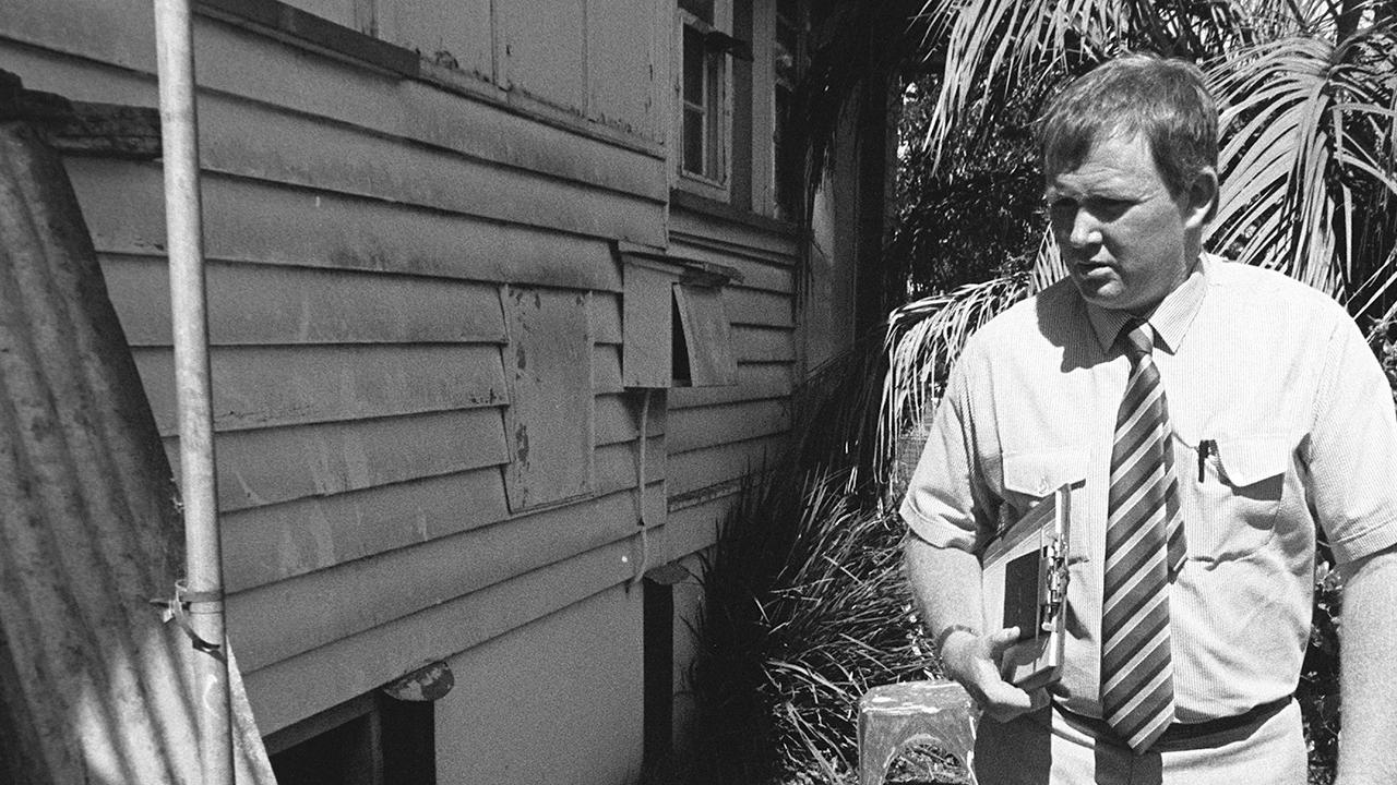 Toowoomba police Detective Mick Bianchi inspects the murder scene in November 1989.