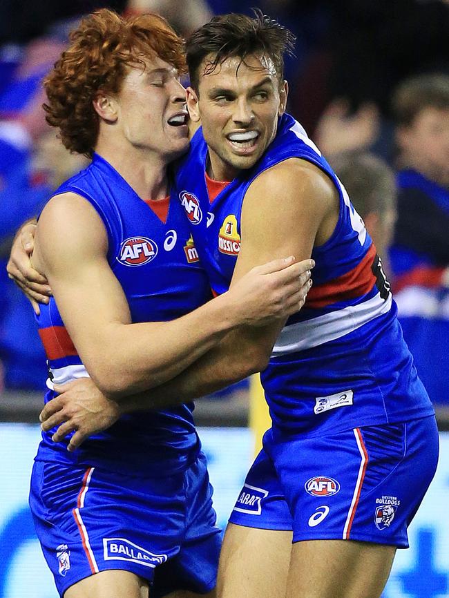 Ed Richards and Sam Lloyd celebrate a third-quarter goal. Picture: Mark Stewart